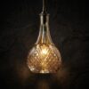 DECANTER retro cut glass bottle pendant light amber glass dark background