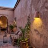 Moroccan Terracotta Dome Wall Sconce - Installed Room Setting Warm Ambient Interior Illumination