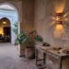 Moroccan Terracotta Pierced Dome Wall Sconce - Installed Room Setting Warm Ambient Interior Illumination