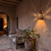 Moroccan Terracotta Cylinder Wall Sconce - Installed Room Setting Warm Ambient Interior Illumination